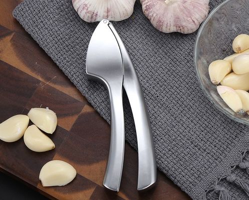 Grado alimenticio Presión de ajo, trituradora de jengibre, exfoliante, exprimidora de 16*3cm, rebarba de cocina múltiple