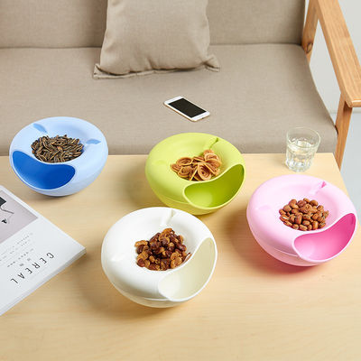 Maximice el tiempo de aperitivos con este contenedor de frutas secas de doble capa y porta teléfonos