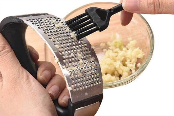 Mejor vendedor de prensa de ajo caliente pelador manual de acero inoxidable para herramientas de frutas y verduras