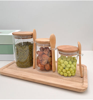 Contenedor de almacenamiento de alimentos de cristal transparente con diseño funcional y tapa redonda de bambú