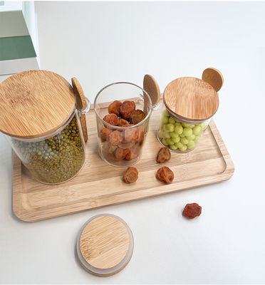 Contenedor de almacenamiento de alimentos de cristal transparente con diseño funcional y tapa redonda de bambú