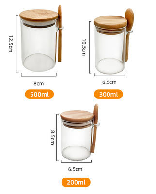 Comida Botellas redondas de vidrio de bambú con tapa y cuchara Caramelos Especias Caffé Frijoles Nueces Galletas