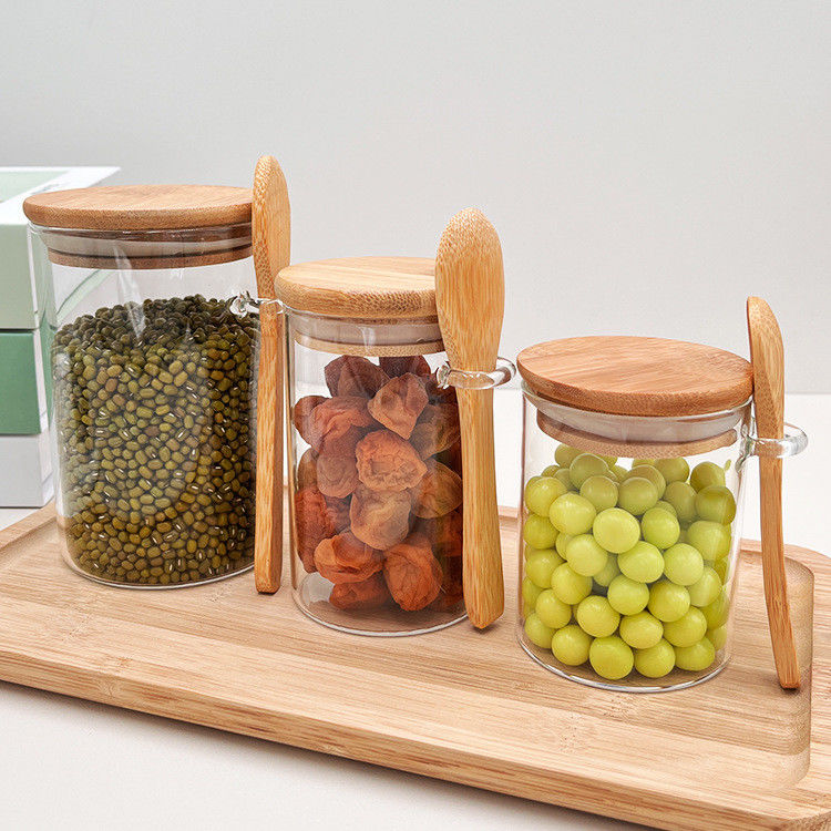 Comida Botellas redondas de vidrio de bambú con tapa y cuchara Caramelos Especias Caffé Frijoles Nueces Galletas